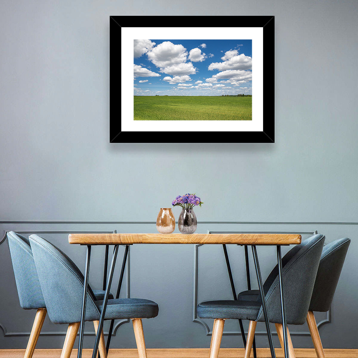 Cloud Filled Sky Over Meadow Wall Art in a room, landscape