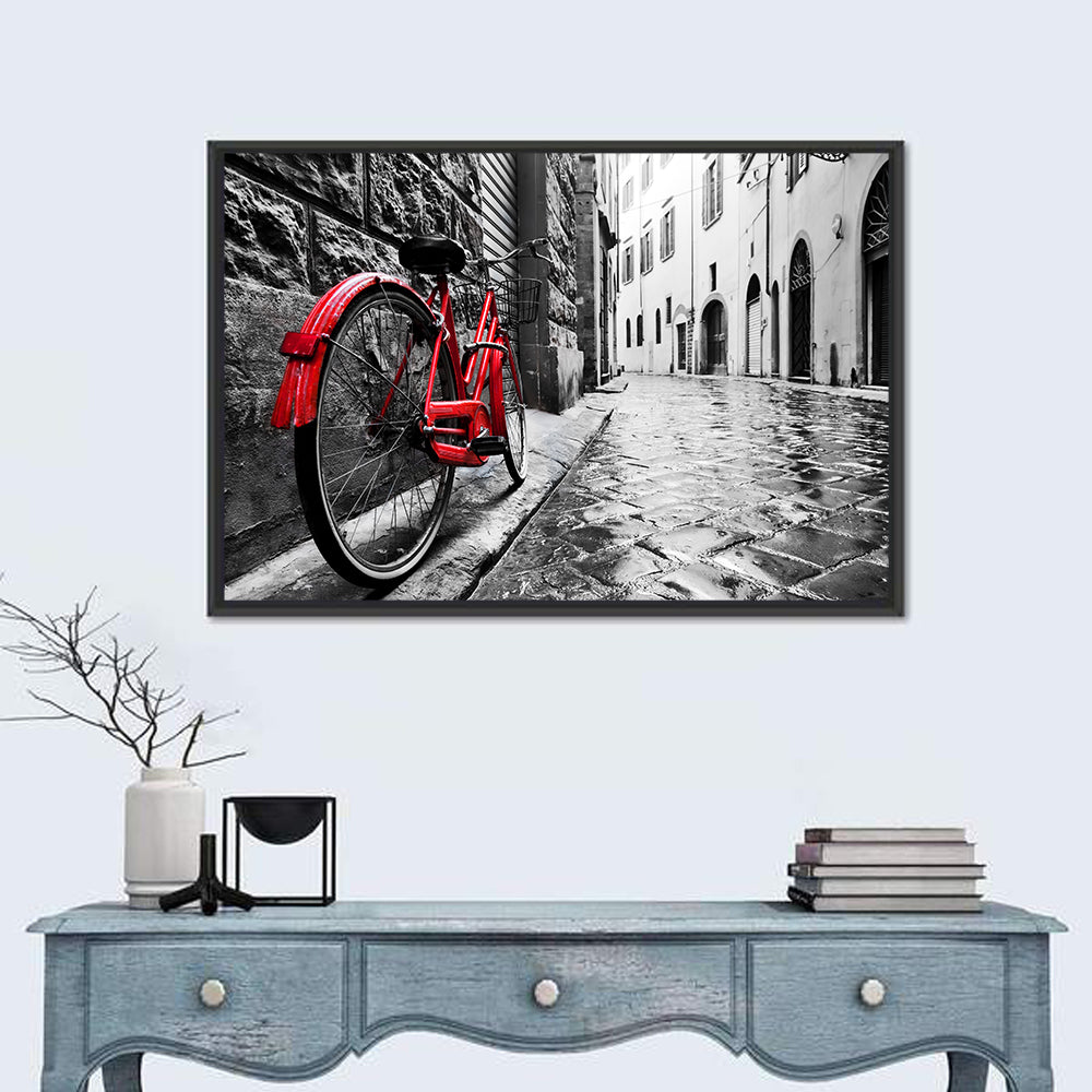 Red Bicycle on Rainy Cobblestone Street Wall Art in a room, landscape