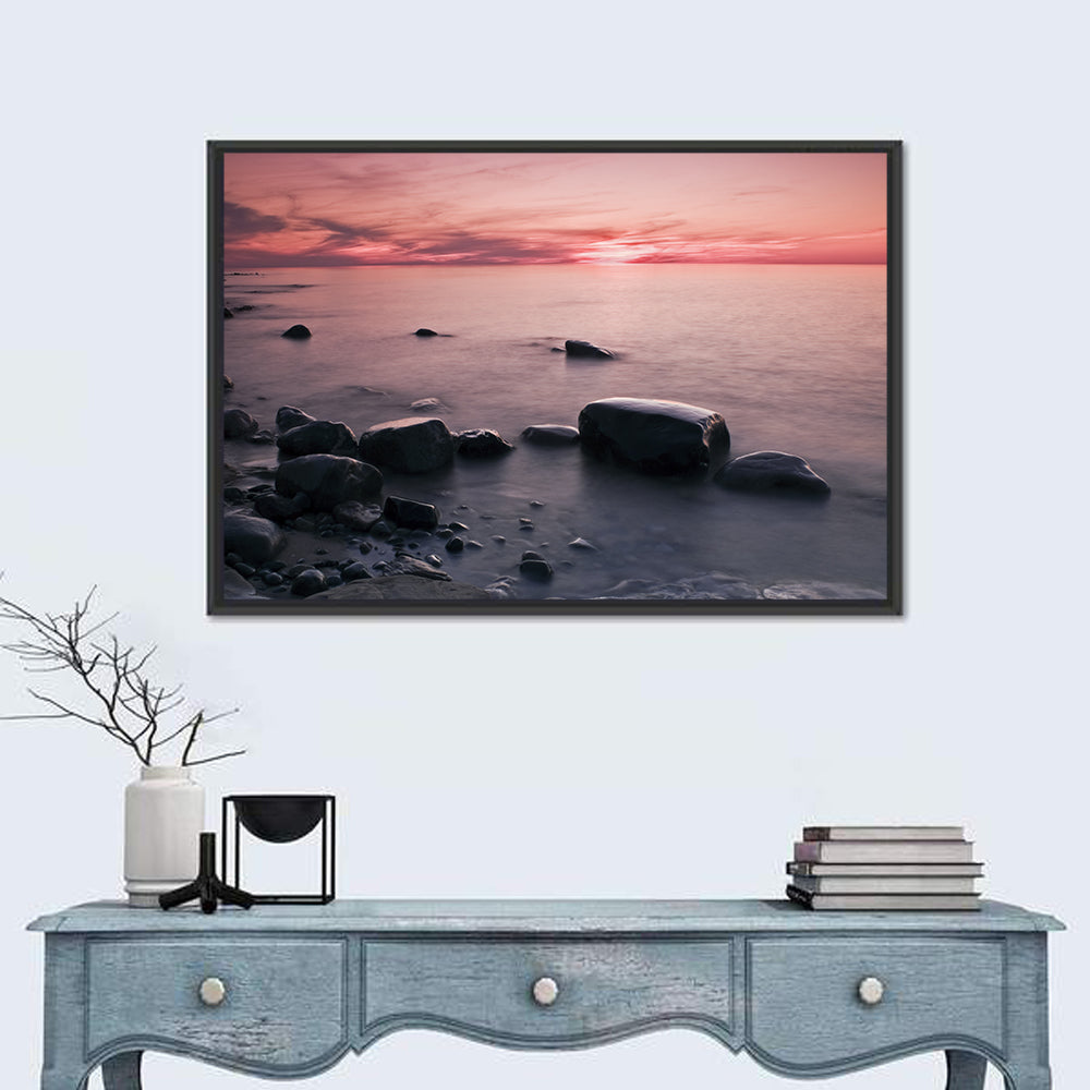 Pink Dusk Lakeshore with Silhouetted Rocks Wall Art
