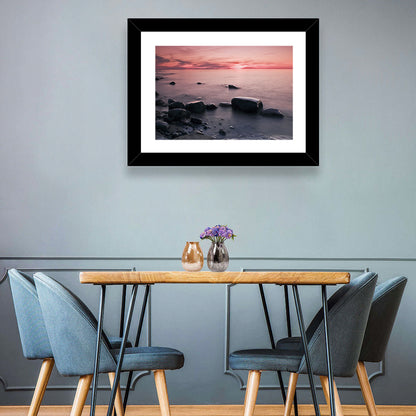 Pink Dusk Lakeshore with Silhouetted Rocks Wall Art