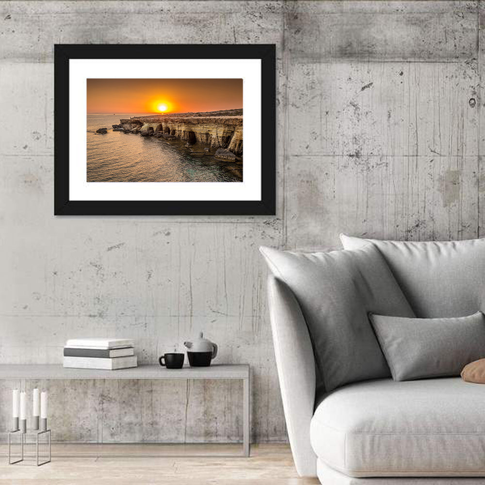 Sunset Over Sea Caves Wall Art in a room, landscape