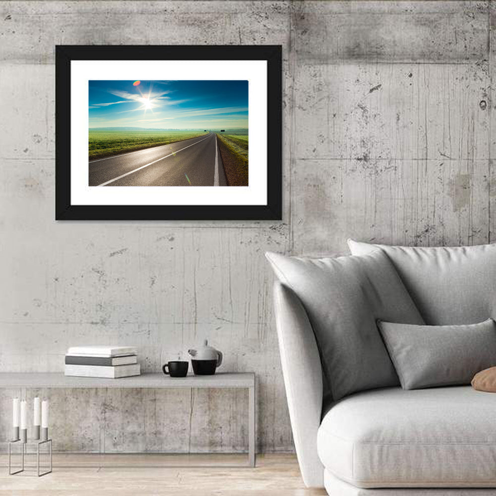 Sunlit Road Through Green Field Wall Art