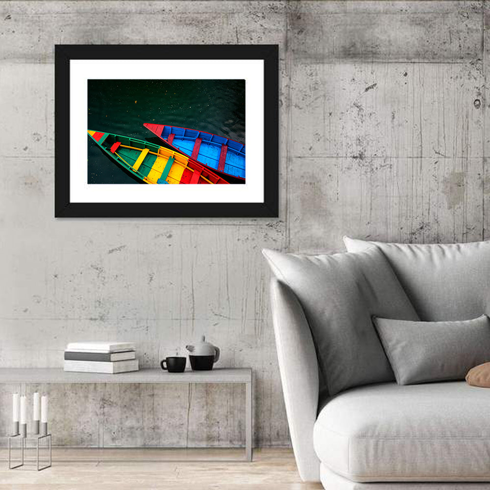 Two Colorful Boats Over Rippling Water Wall Art in a room, landscape