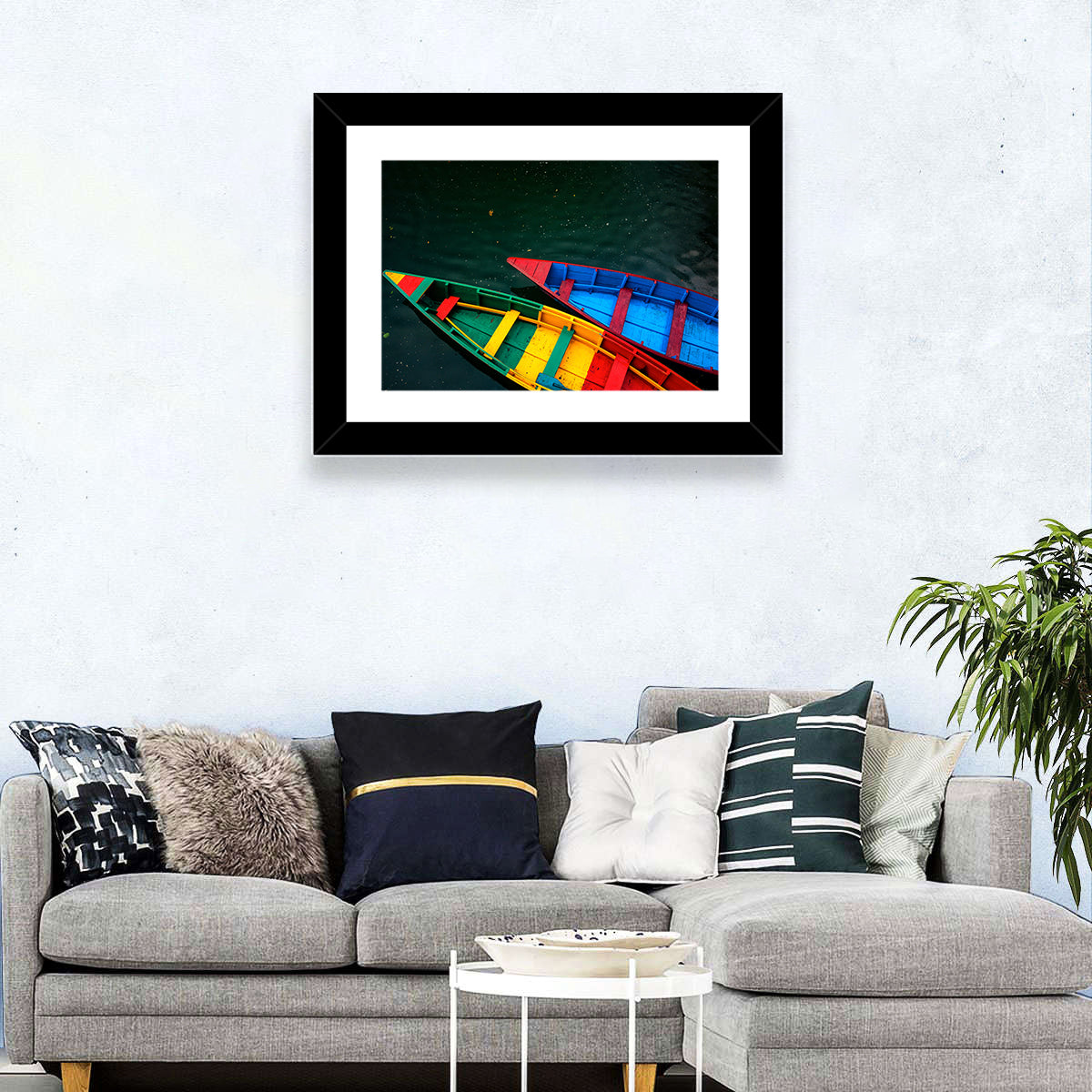 Two Colorful Boats Over Rippling Water Wall Art in a room, landscape