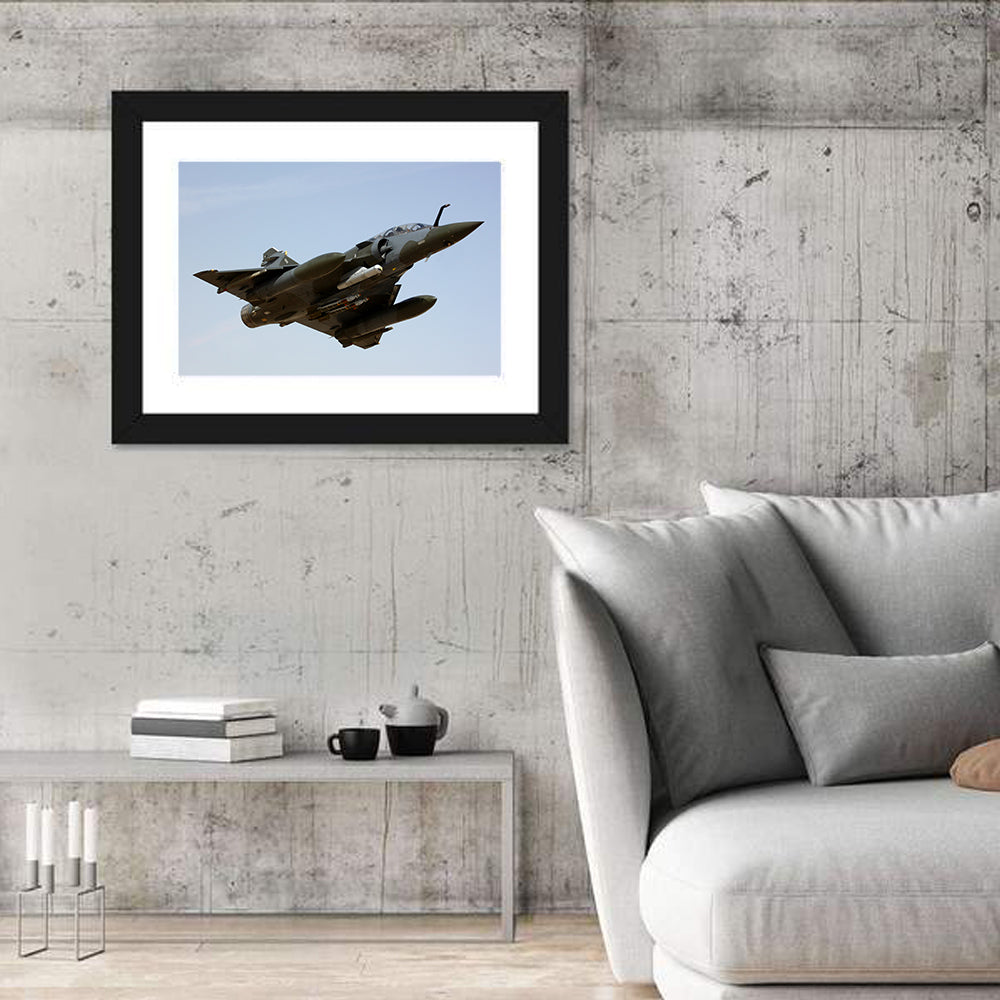 Camouflaged Fighter Jet in Flight Wall Art in a room, landscape