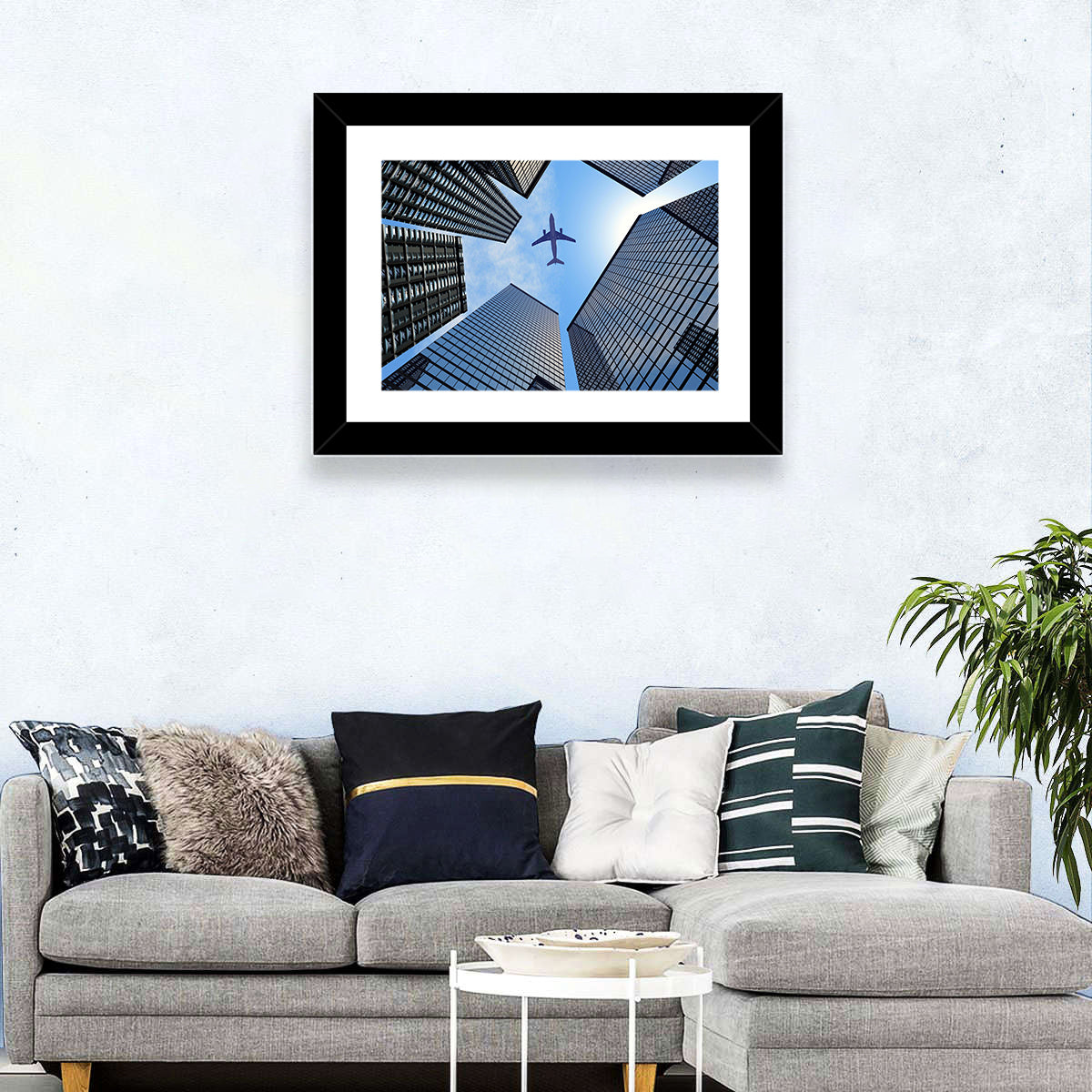 Airplane Above Skyscrapers Wall Art in a room, landscape