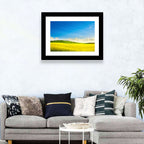 Rapeseed Field and Rolling Hills Under Blue Sky Wall Art
