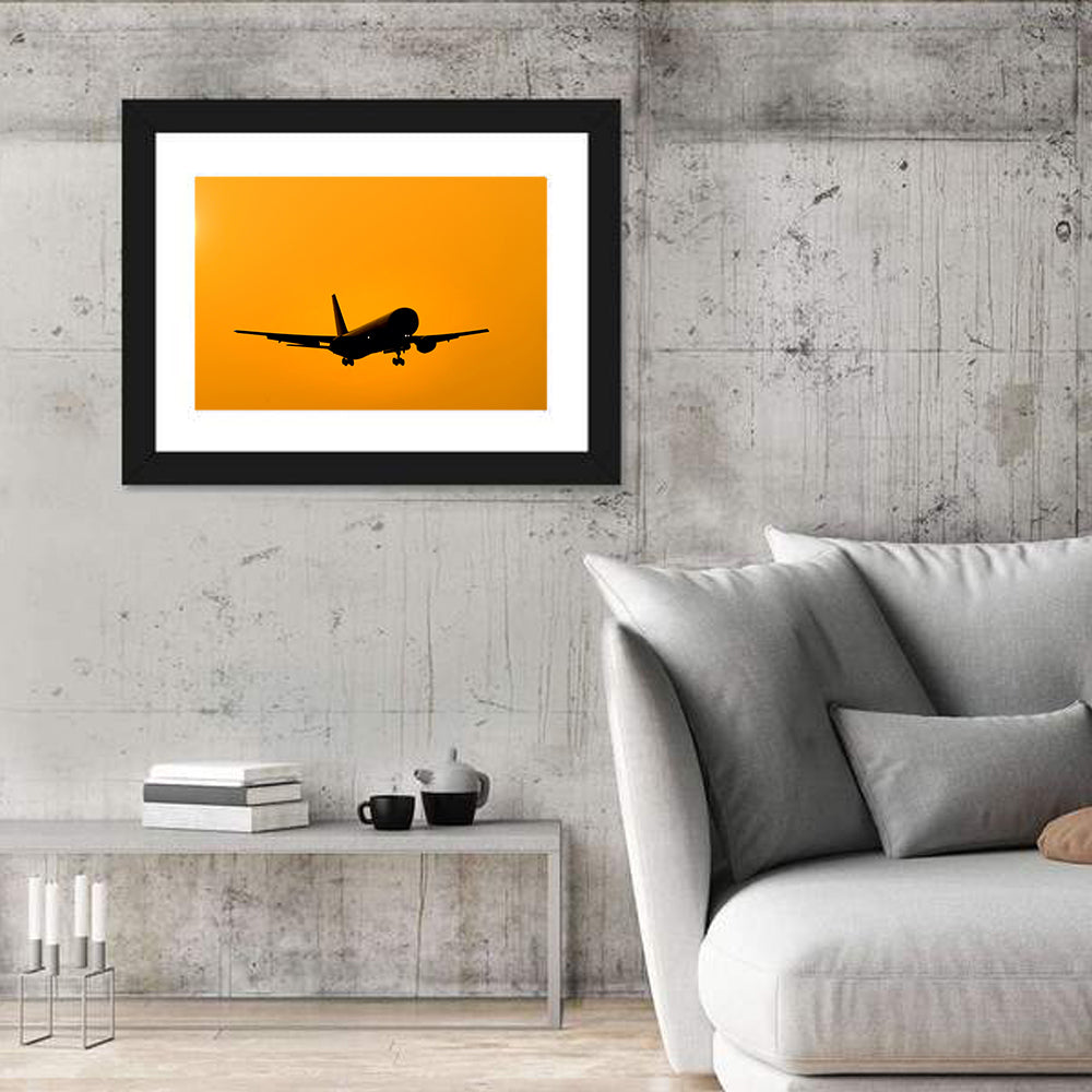Golden Hour Airliner Silhouette Wall Art in a room, landscape