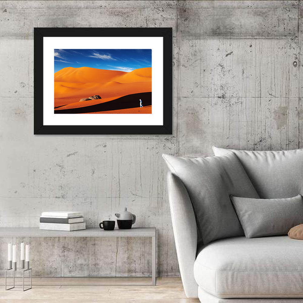 Solitary Figure on Sahara Dunes Wall Art in a room, landscape