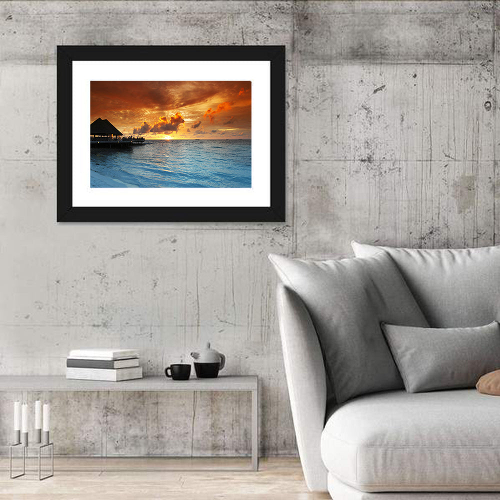 Overwater Bungalow Sunset Pier Wall Art in a room, landscape