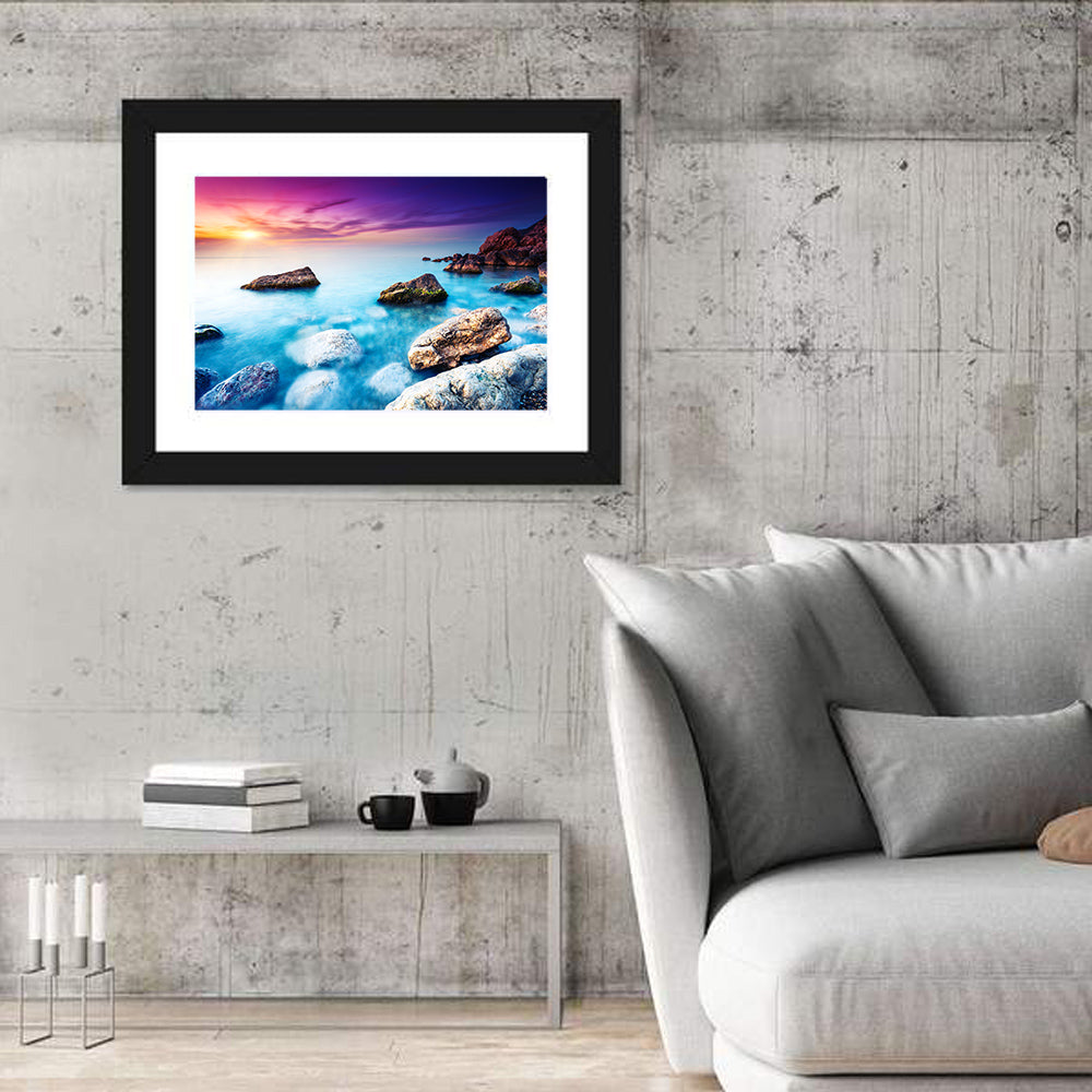Rocky Beach Sunset Wall Art in a room, landscape
