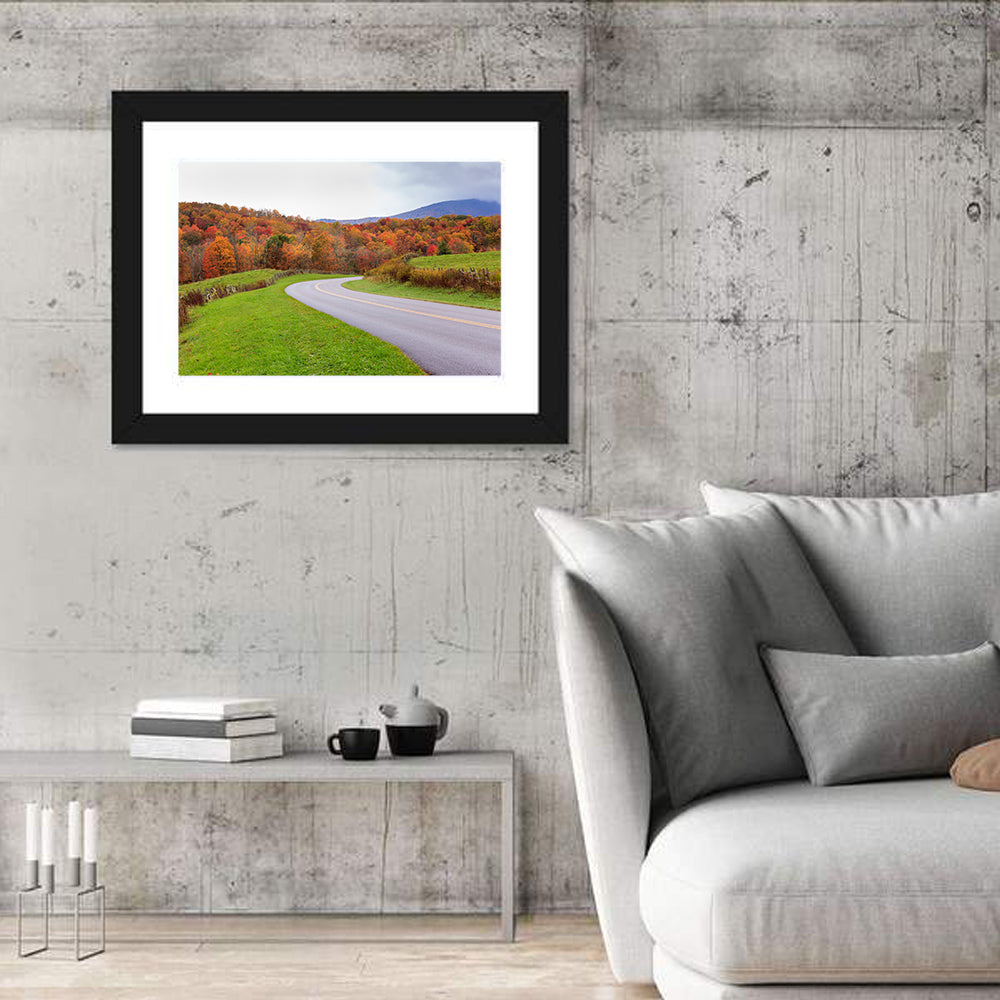 Curving Road Through Autumn Meadow Wall Art in a room, landscape