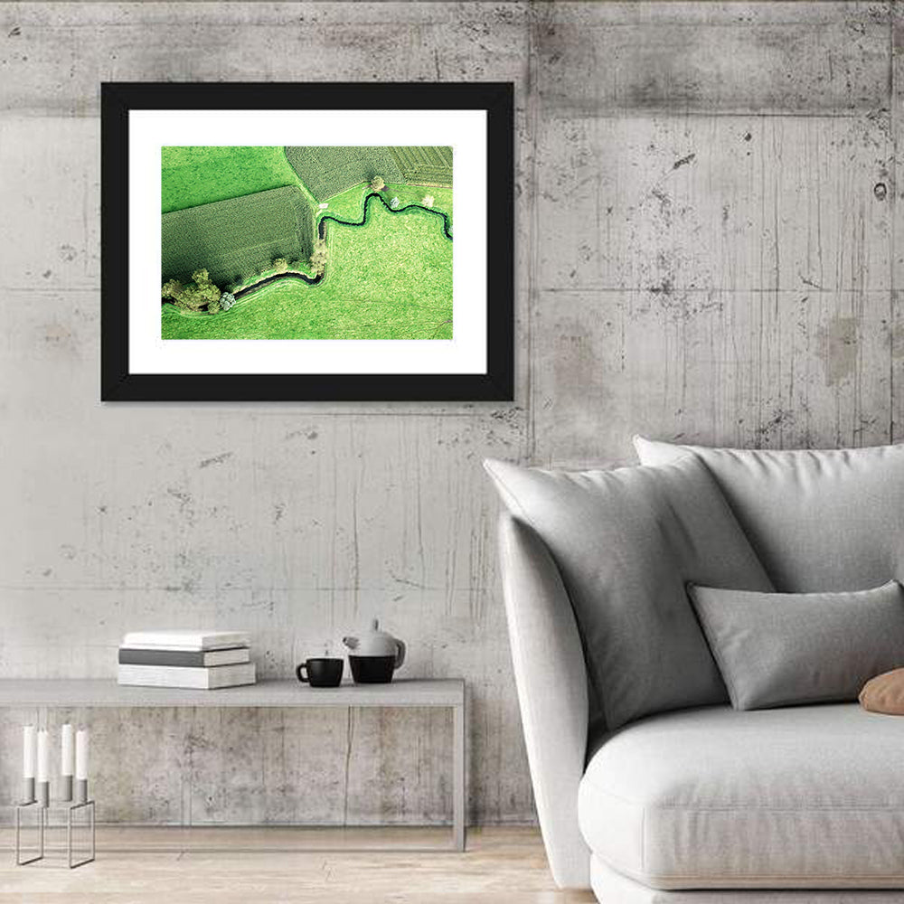 Meandering Stream Over Farmland Wall Art in a room, landscape