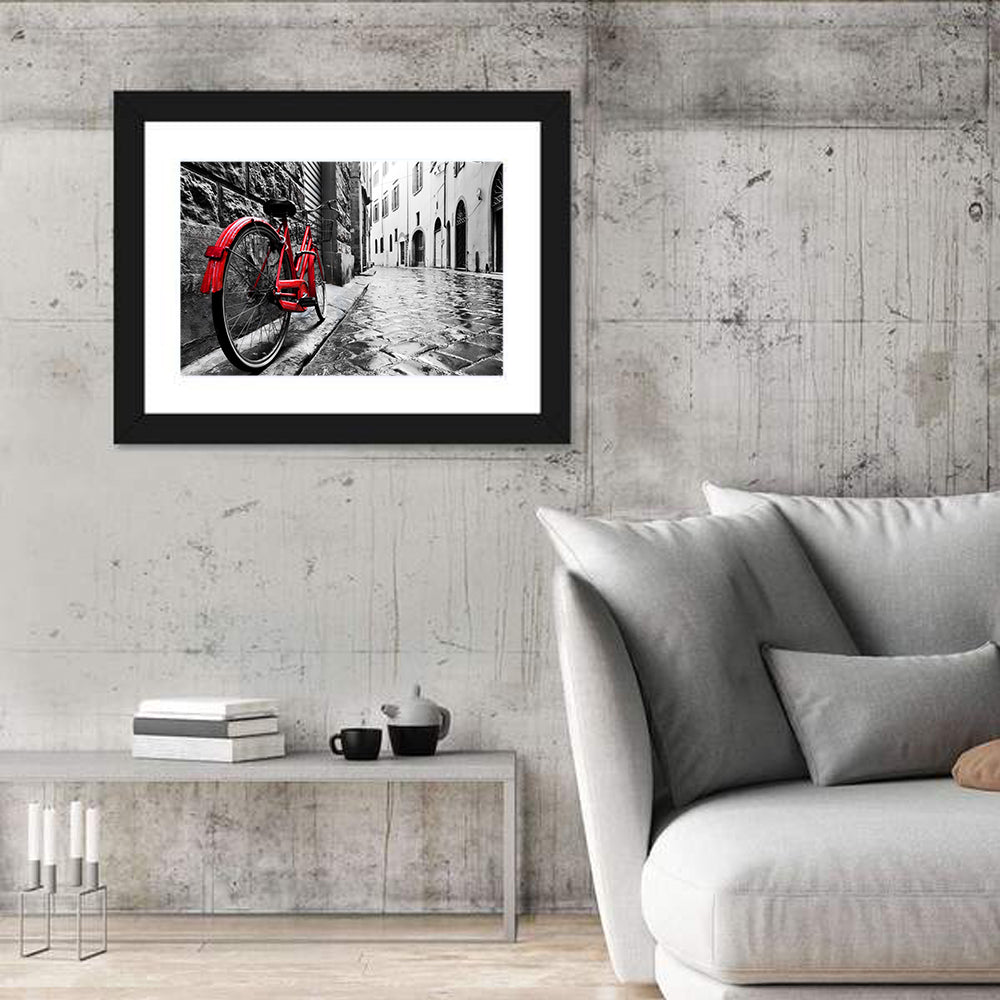 Red Bicycle on Rainy Cobblestone Street Wall Art