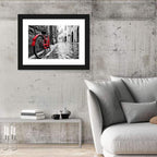 Red Bicycle on Rainy Cobblestone Street Wall Art