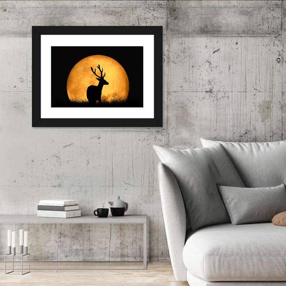 Buck Silhouette Under Red Moon Wall Art in a room, landscape