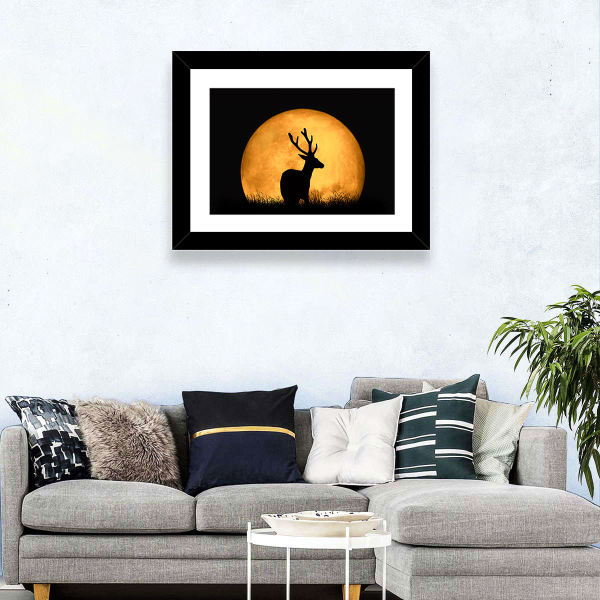 Buck Silhouette Under Red Moon Wall Art in a room, landscape