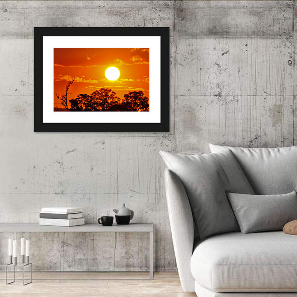 Burning Sun Over Tree Silhouettes Wall Art in a room, landscape