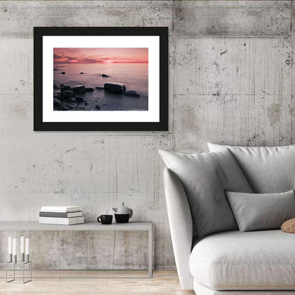 Pink Dusk Lakeshore with Silhouetted Rocks Wall Art