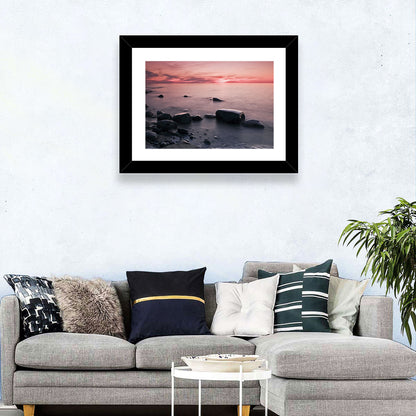 Pink Dusk Lakeshore with Silhouetted Rocks Wall Art
