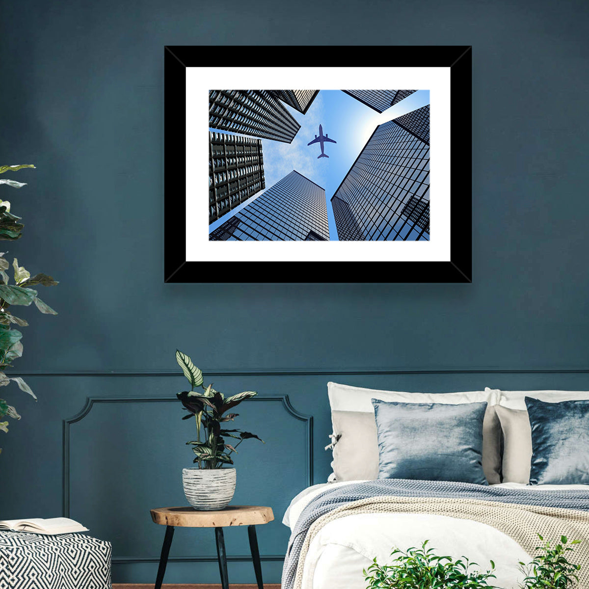 Airplane Above Skyscrapers Wall Art in a room, landscape