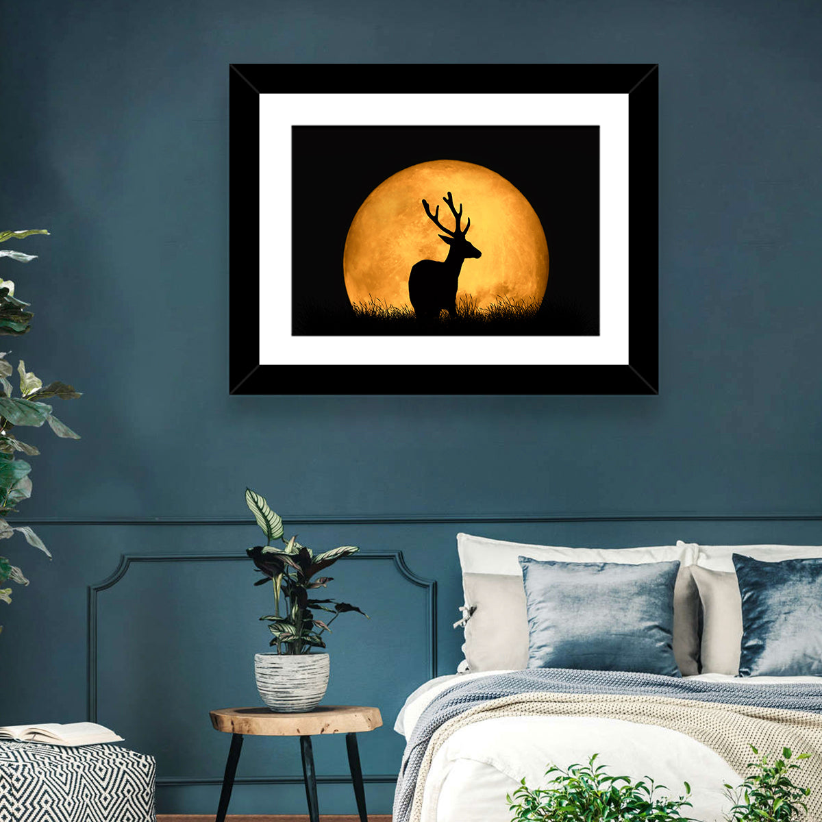 Buck Silhouette Under Red Moon Wall Art in a room, landscape