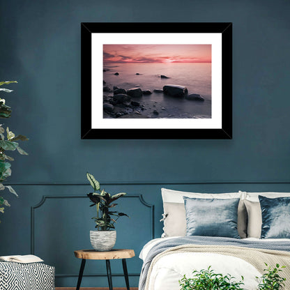 Pink Dusk Lakeshore with Silhouetted Rocks Wall Art