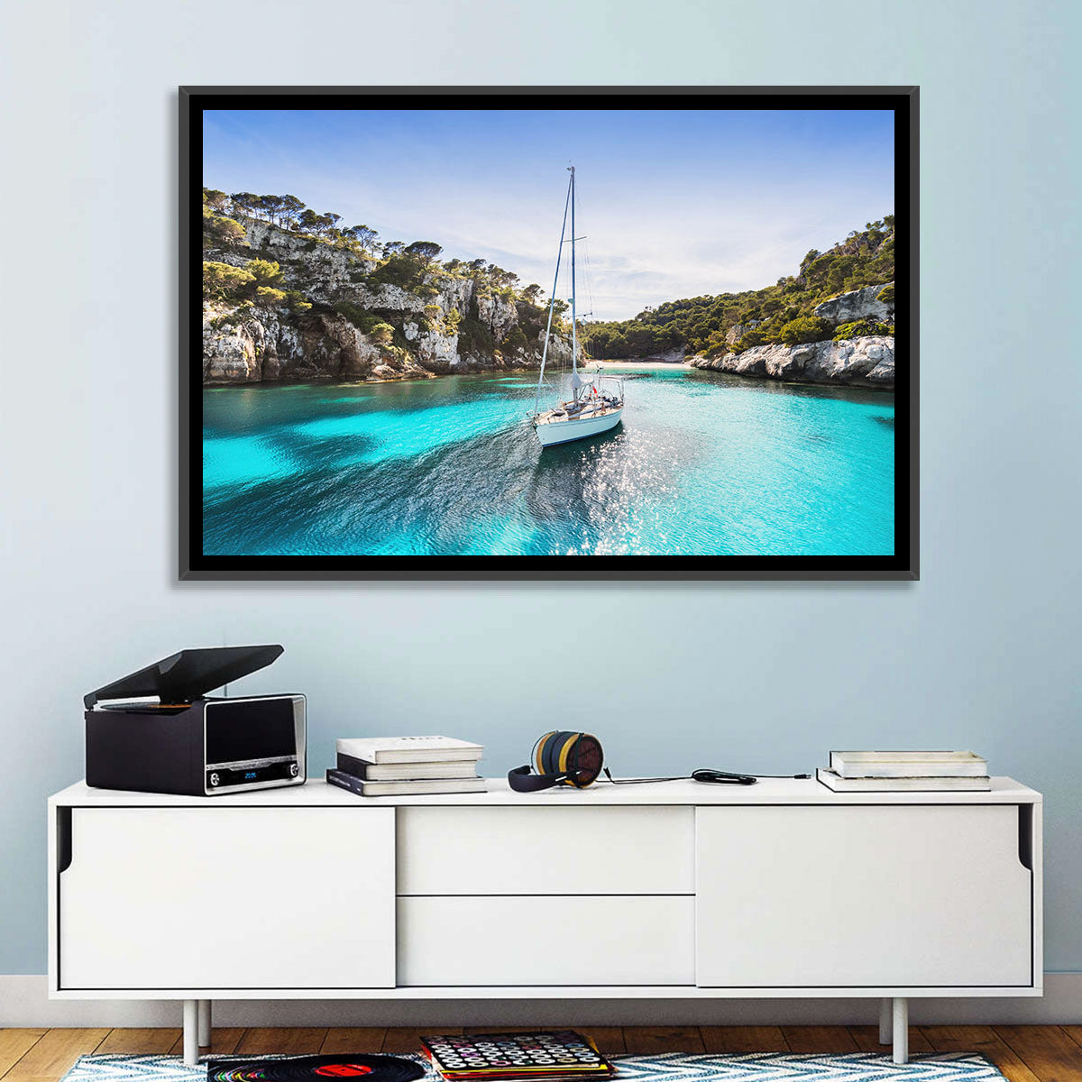 Menorca Cove Sailboat Wall Art in a room, landscape