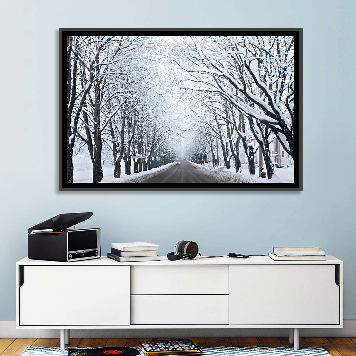 Snowy Road with Distant Headlights Wall Art in a room, landscape