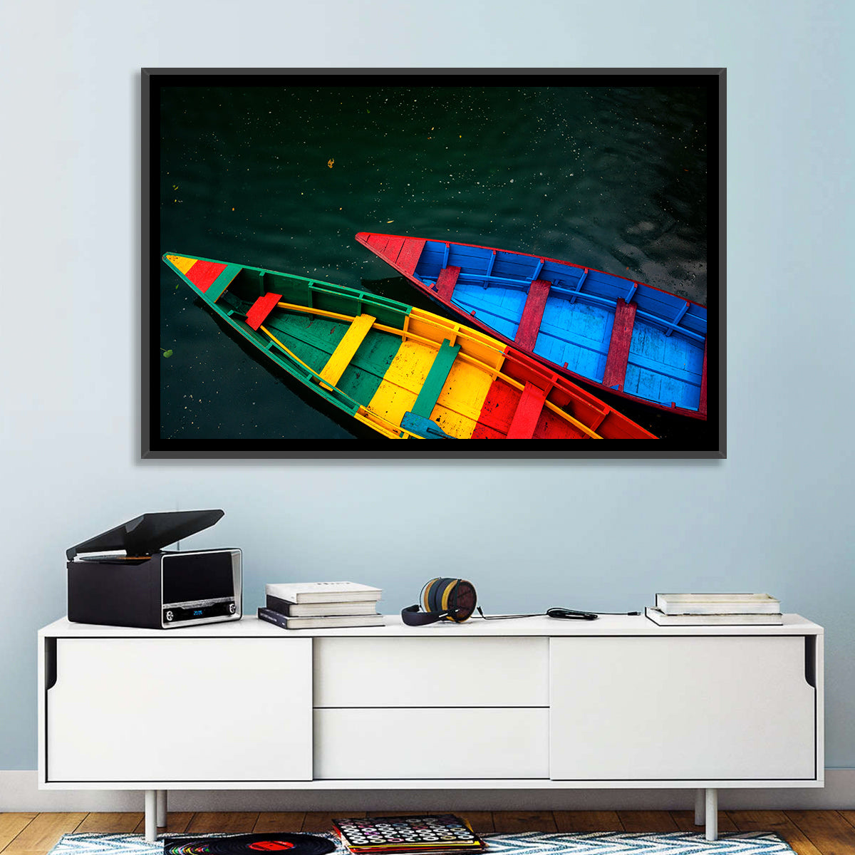 Two Colorful Boats Over Rippling Water Wall Art in a room, landscape