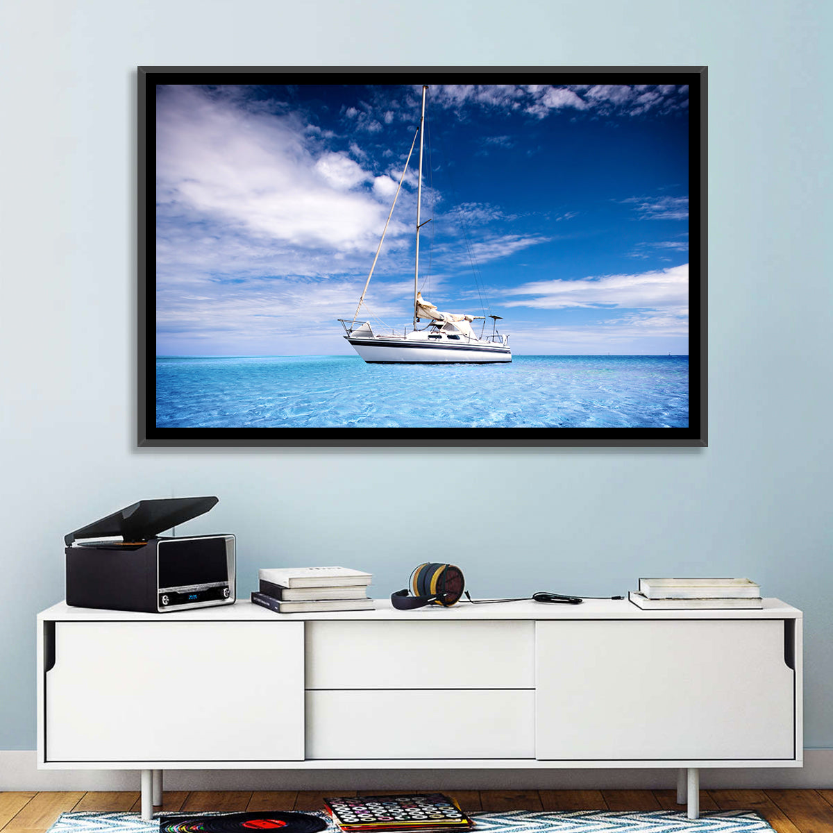 Furled Sails Over Turquoise Water Wall Art in a room, landscape
