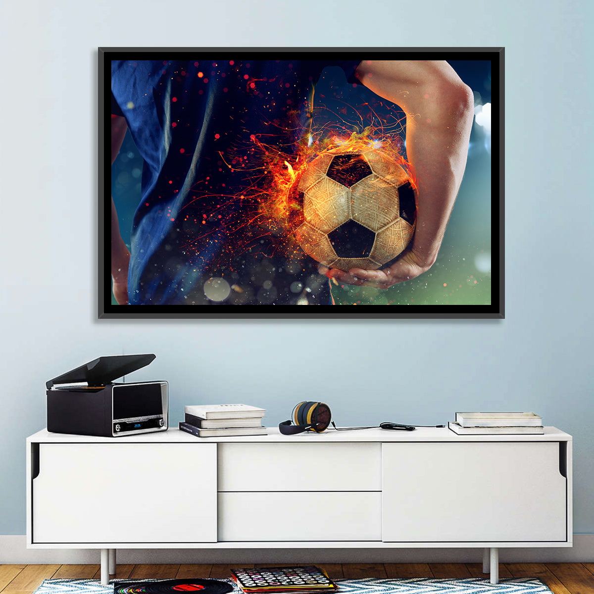 Fiery Soccer Ball and Blue Jersey Player Wall Art in a room, landscape