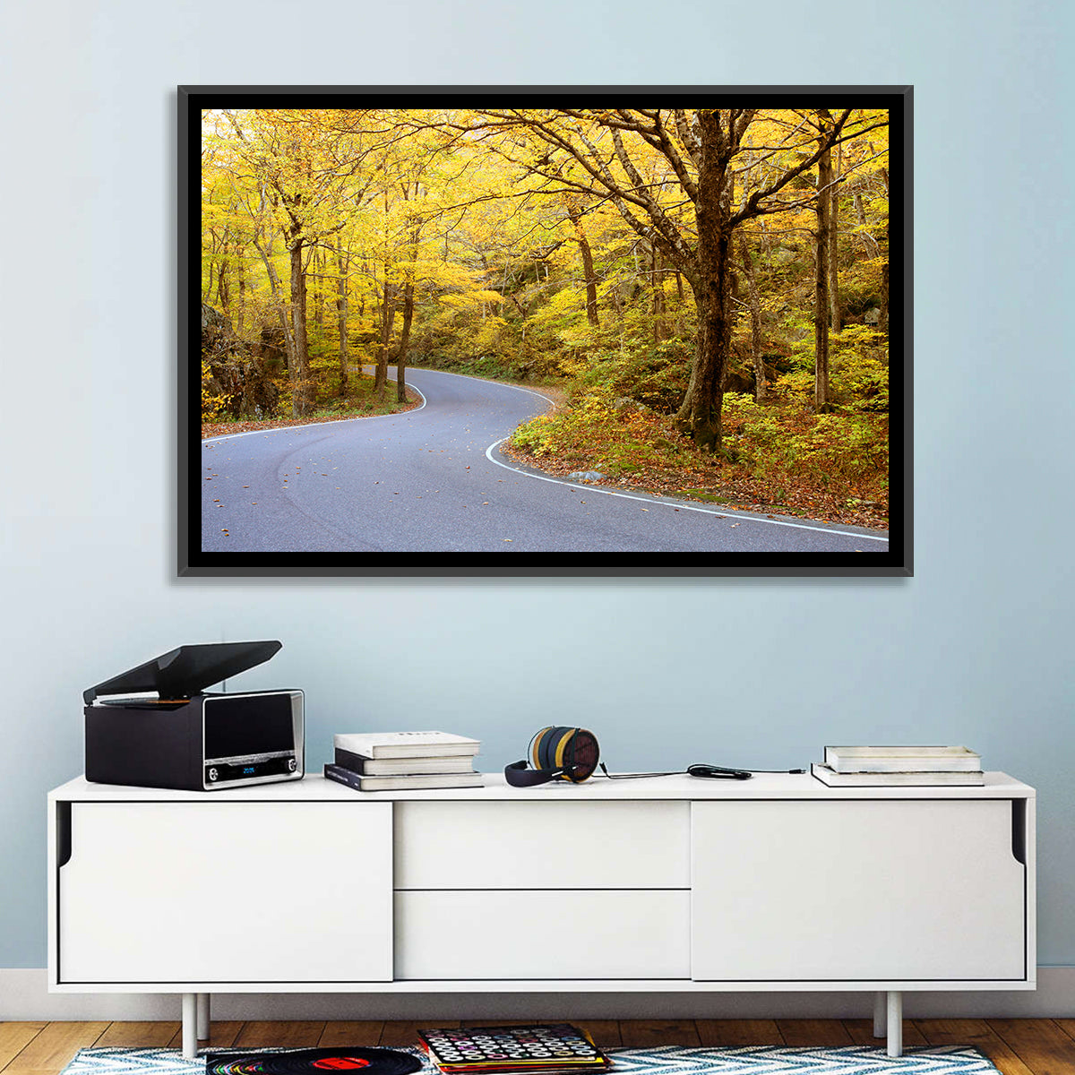 Winding Road Through Autumn Foliage Wall Art in a room, landscape