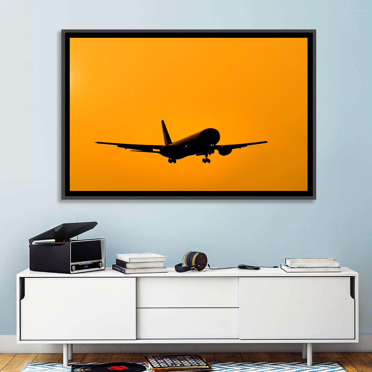 Golden Hour Airliner Silhouette Wall Art in a room, landscape