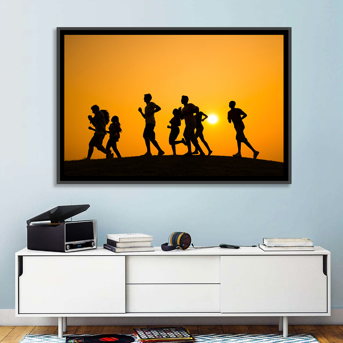 Six Runners Silhouette at Golden Sunset Wall Art in a room, landscape
