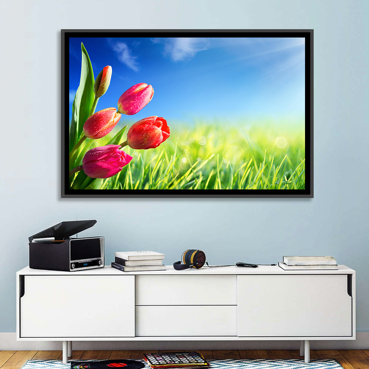 Dewy Red Tulips Under Blue Sky Wall Art in a room, landscape