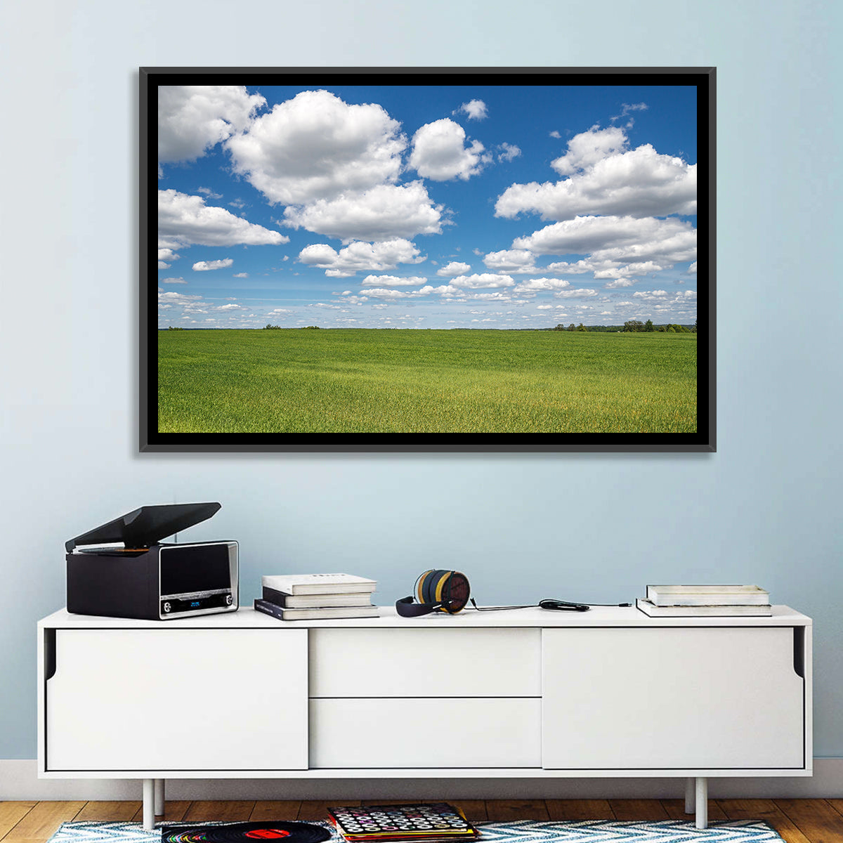 Cloud Filled Sky Over Meadow Wall Art in a room, landscape