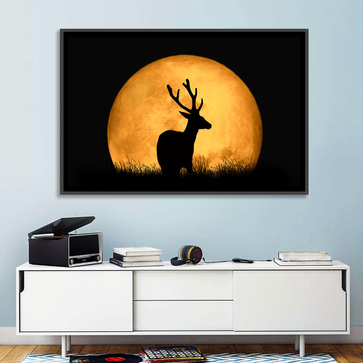 Buck Silhouette Under Red Moon Wall Art in a room, landscape