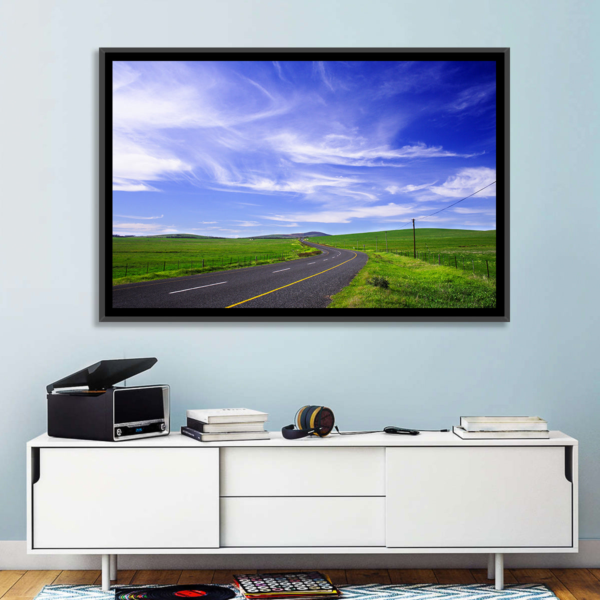 Winding Country Road in Green Fields Wall Art in a room, landscape