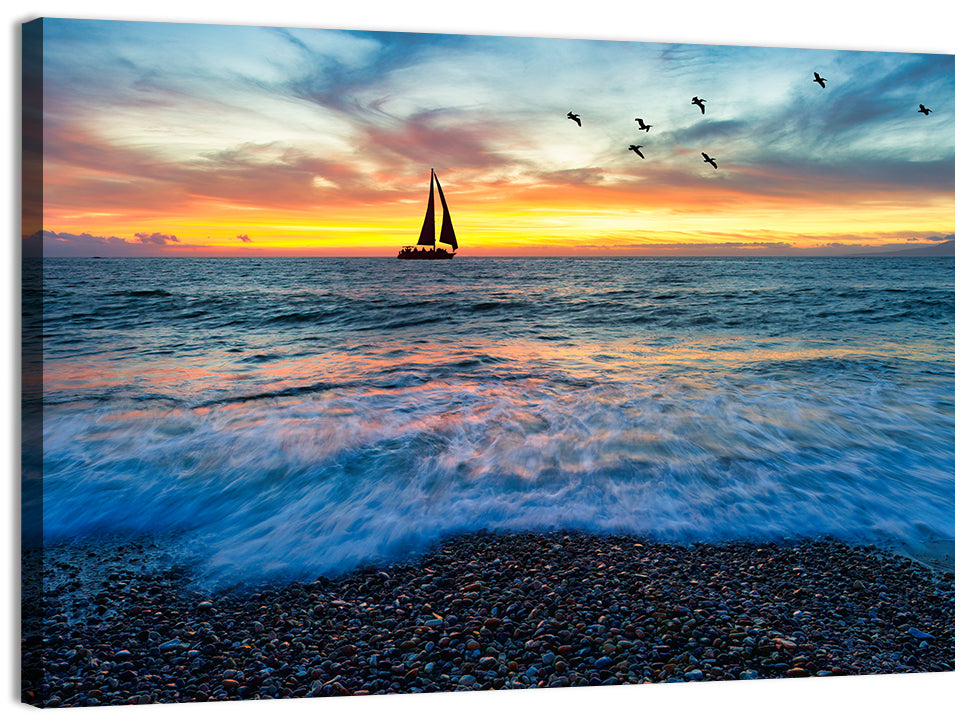 Sunset Sailboat Over Pebble Shore Wall Art, canvas print, landscape