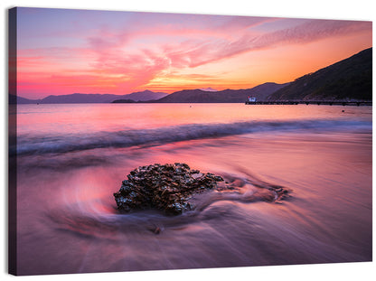 Pink Sunset Over Rock and Pier Wall Art