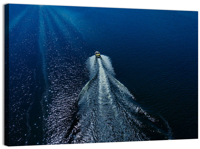 Aerial Boat Over Deep Blue Water Wall Art as a canvas print