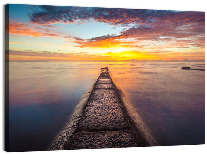 Stone Pier to Glowing Horizon Wall Art as a canvas print