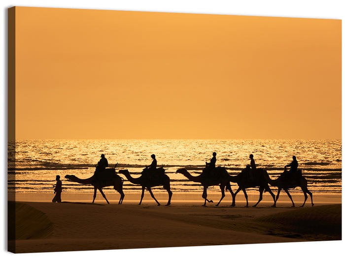 Camel Caravan Silhouette on Wet Sand Wall Art as a canvas print