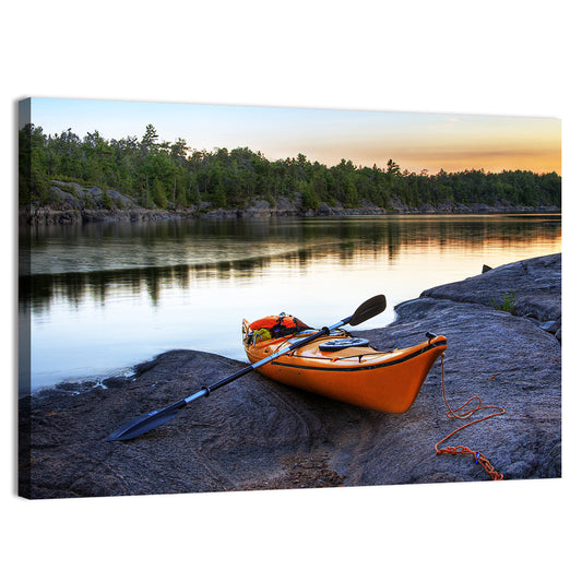 Orange Kayak on Rocky Shore Wall Art