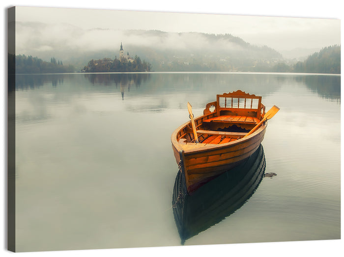 Wooden Boat on Misty Lake Bled Wall Art as a canvas print