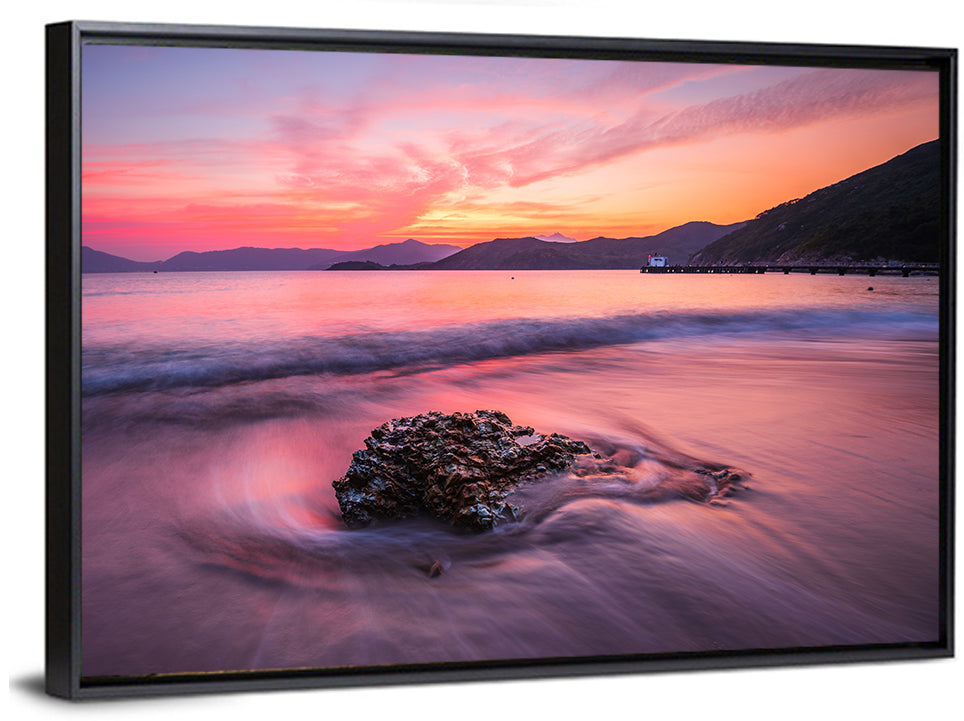 Pink Sunset Over Rock and Pier Wall Art