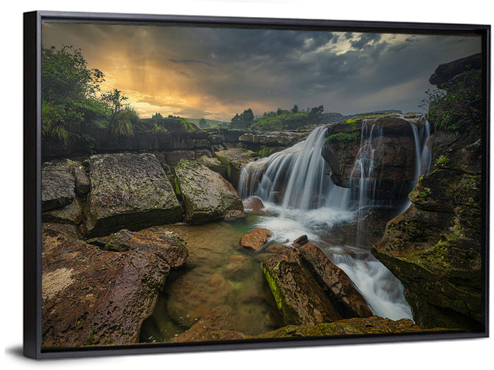 Mossy Rocks Waterfall at Golden Sky Wall Art as a framed canvas