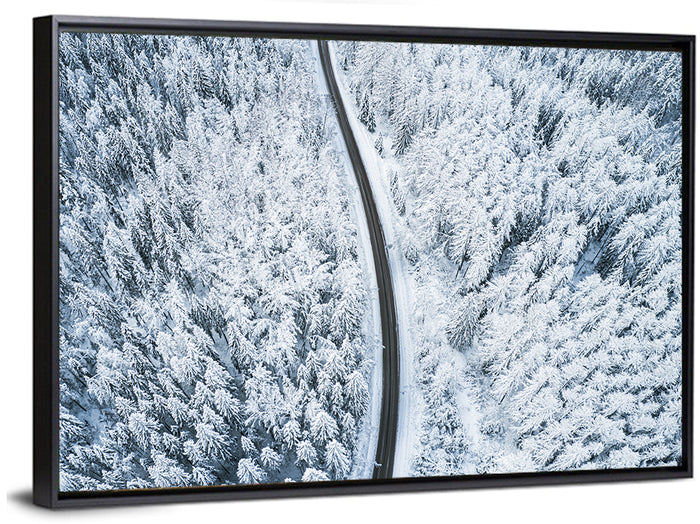 Winding Snow-covered Forest Road Wall Art as a framed canvas