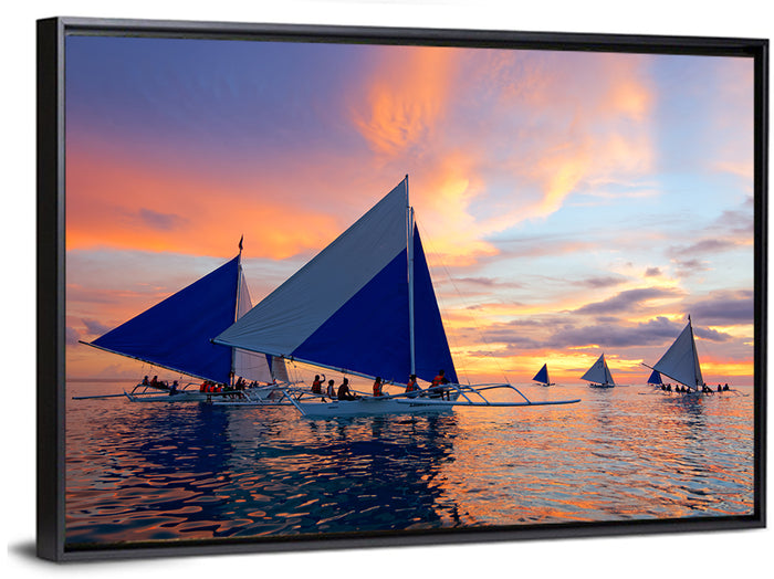Outrigger Sailboats at Sunset Wall Art as a framed canvas